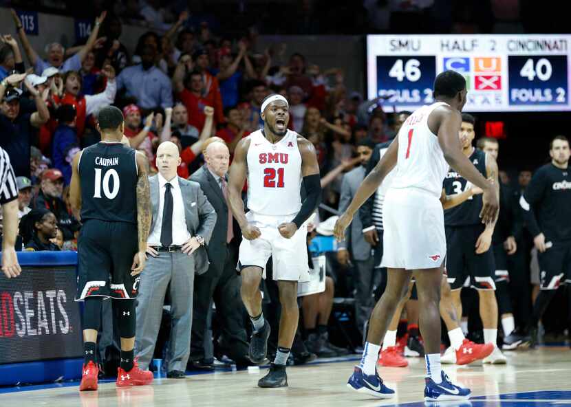 SMU guard Ben Emelogu II (21) was pumped up as the Mustangs took charge in Sunday's game at...
