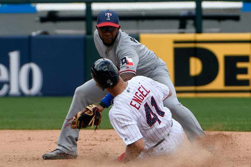 Chicago White Sox's Adam Engel (41) is tagged out on a steal-attempt of second base by Texas...