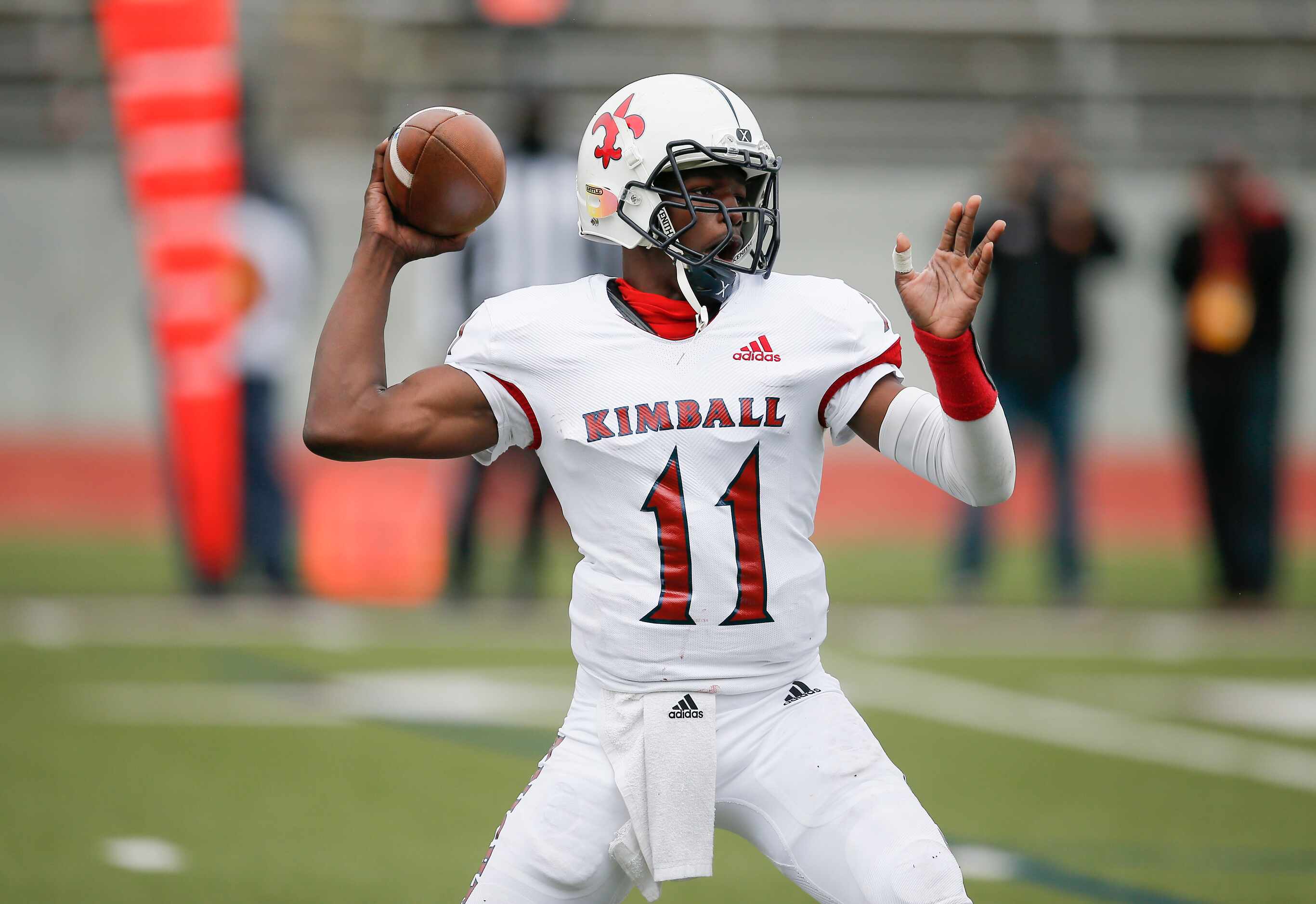 Kimball senior quarterback Keith Hargraves (11) throws during the first half of a high...