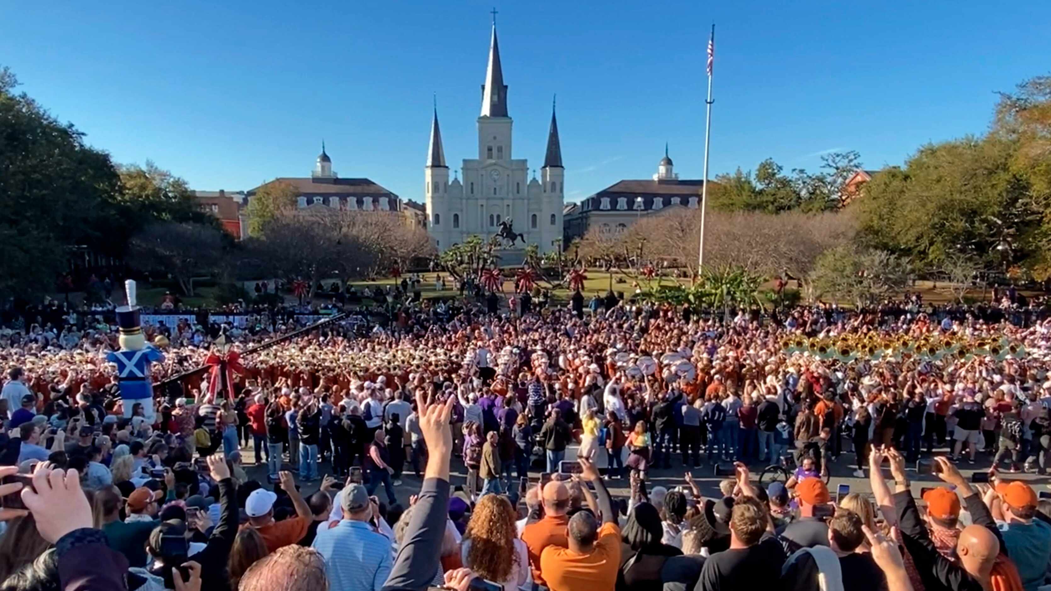 University of Texas Longhorn Band plays the Texas Fight song in Jackson Square as they...