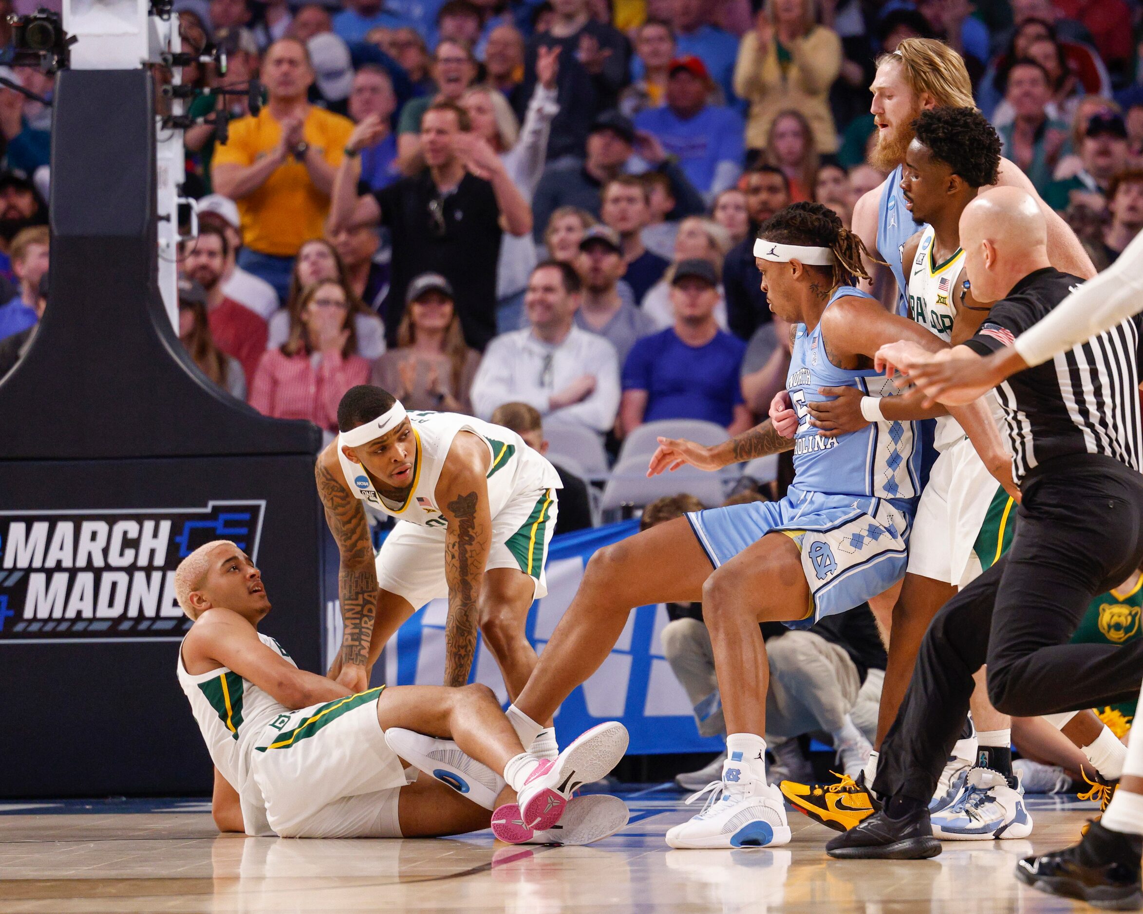 North Carolina Tar Heels forward Armando Bacot (5) is entangled with Baylor Bears forward...