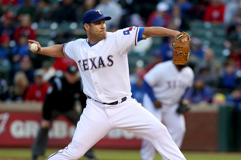 Texas Rangers starting pitcher Colby Lewis (48) in the second inning of MLB Baseball action...