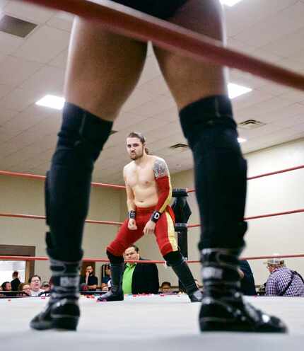Professional wrestlers Davey Vega, in red, and Jerome Daniels square off during a VIP...