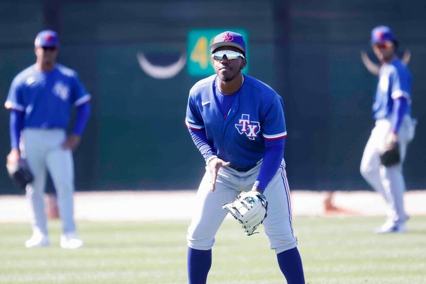Texas Rangers minor league infielder Danyer Cueva fields during a spring training workout at...