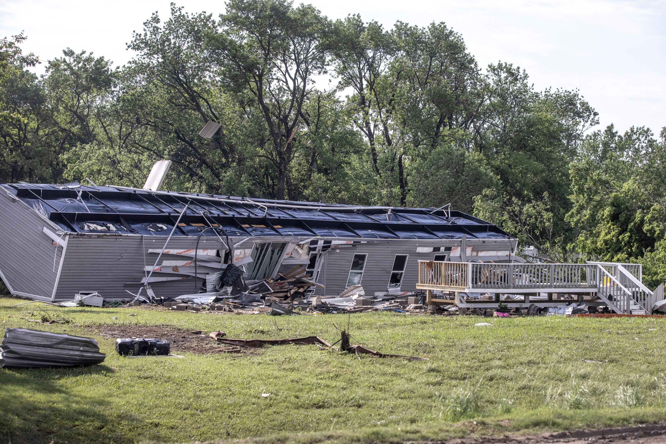 A mobile home was turned upside down in the aftermath of a Monday night tornado that touched...