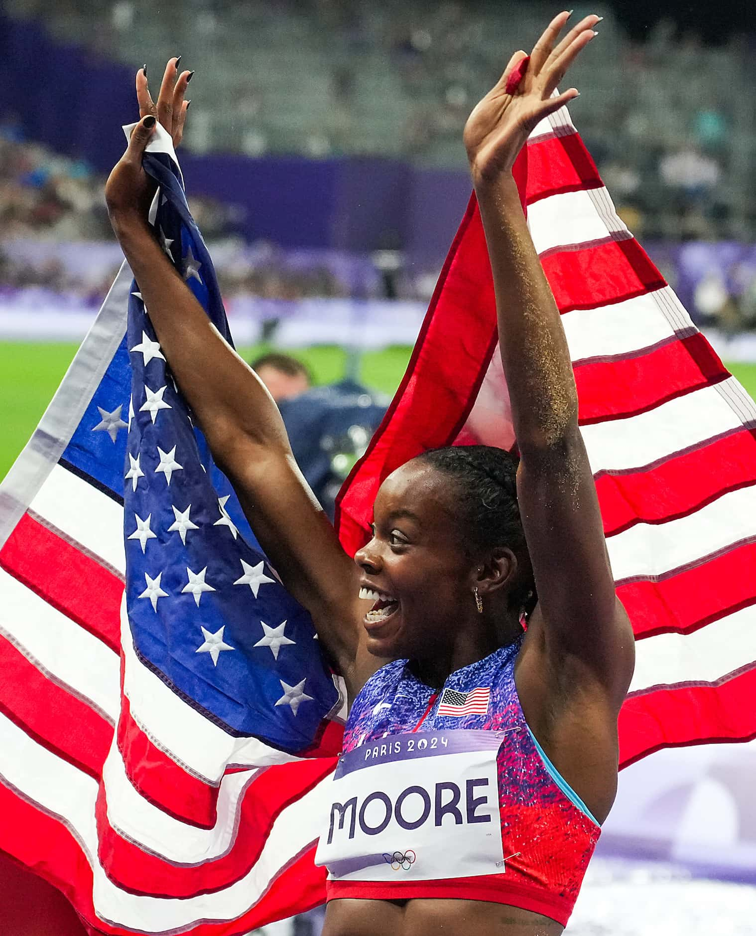 Jasmine Moore of the United States celebrates after winning the bronze medal in the women’s...