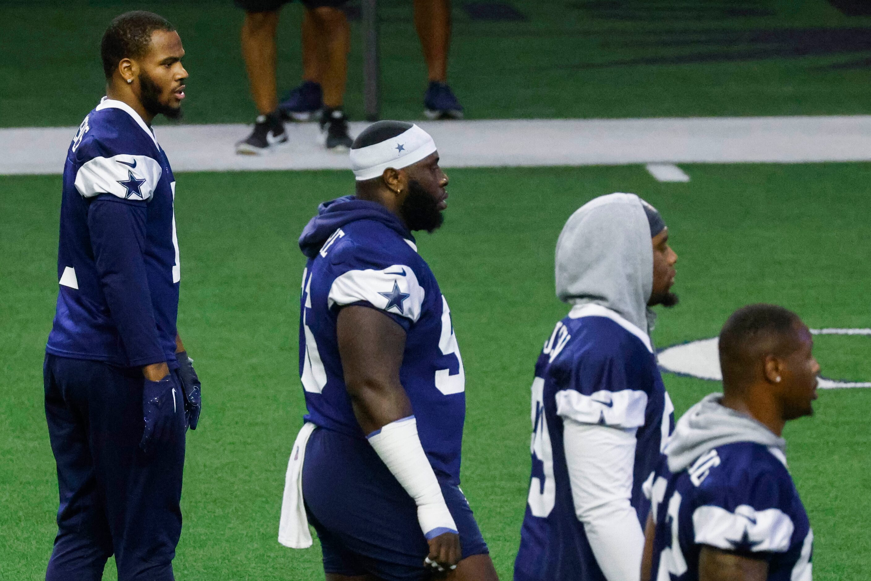 Dallas Cowboys linebacker Micah Parsons (left) take part during OTA practice on Thursday,...