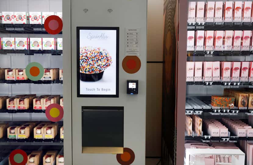 Touchscreen vending machines sell Sprinkles fresh baked goods (left) and Kylie makeup in...