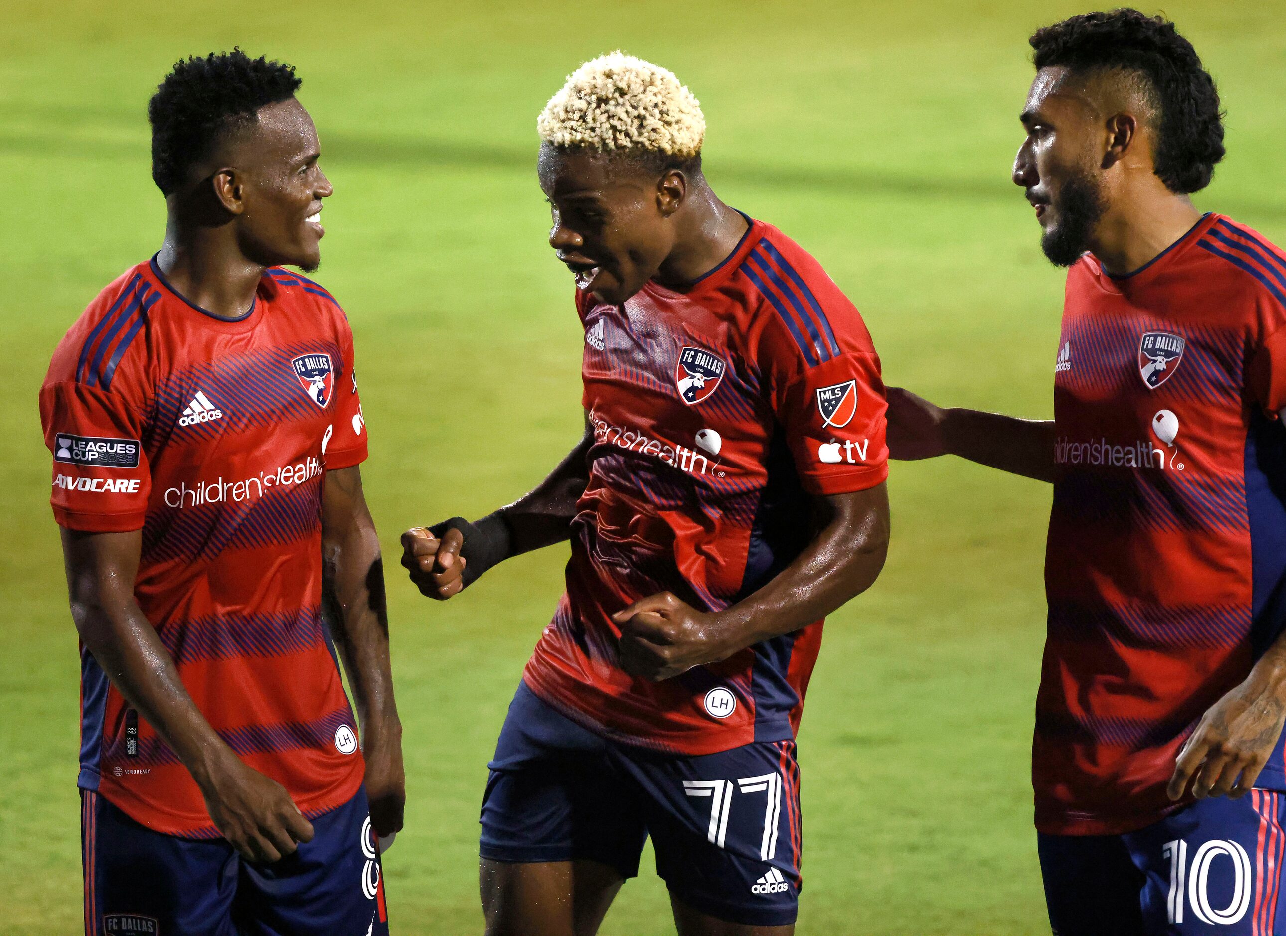 FC Dallas forward Bernard Kamungo (77) celebrates his first half goal with forward Jáder...