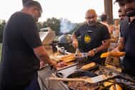 (From left) Neghae Mawla and Rehan Jaffrey prepare a Philly Cheesesteak as the Halal BBQ...
