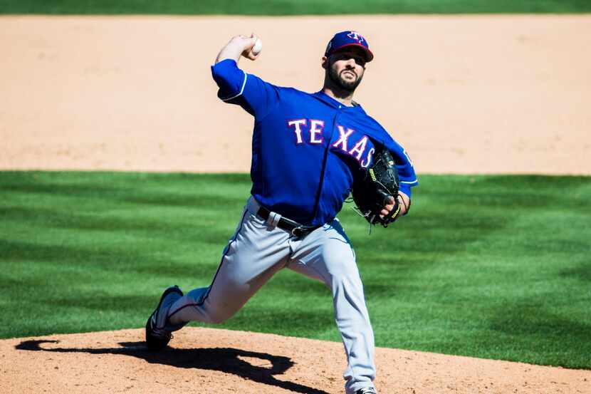 Texas Rangers starting pitcher Dillon Gee (36) pitches during the fourth inning of a spring...