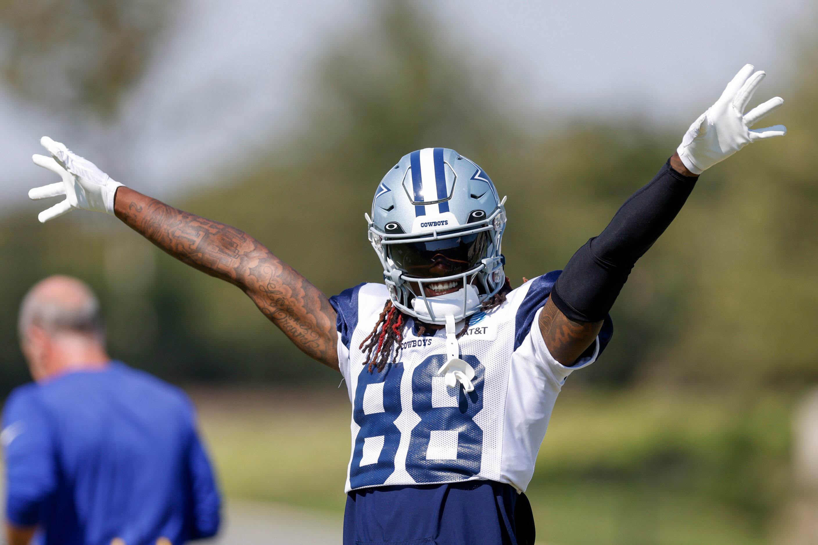 Dallas Cowboys wide receiver CeeDee Lamb (88) raises his arms during a practice at The Star,...