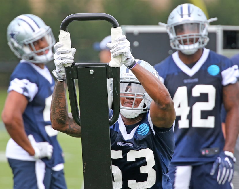 Dallas Cowboys linebacker Justin March-Lillard (53) hits the sled at Dallas Cowboys...