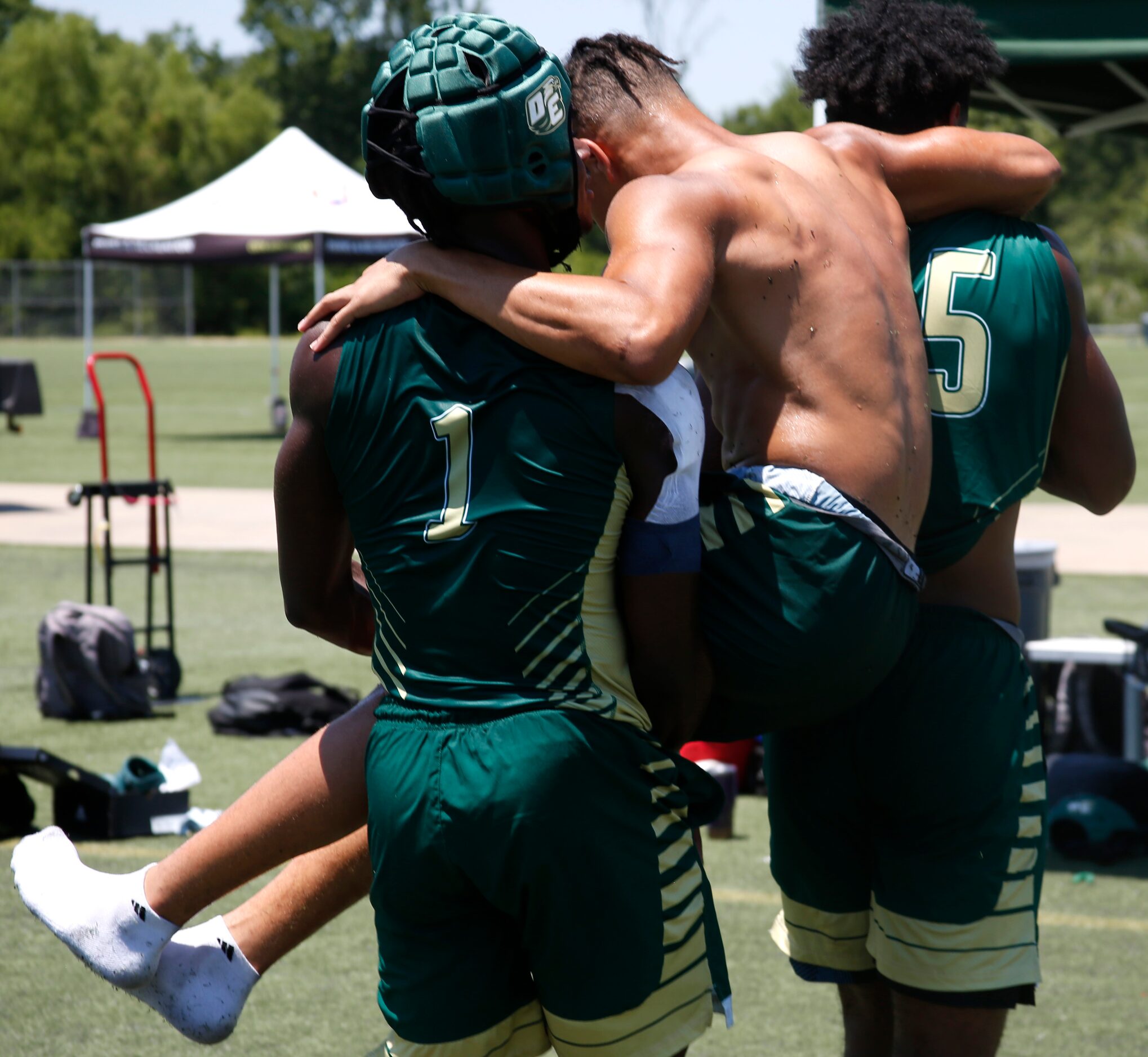 DeSoto Eagles players Johntay Cook ll (1), left, and Keshaun Jackson (15), right, combine to...