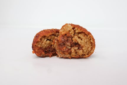 Pulled pork arancini is Eataly's new 2024 State Fair of Texas concession item. Inside each...