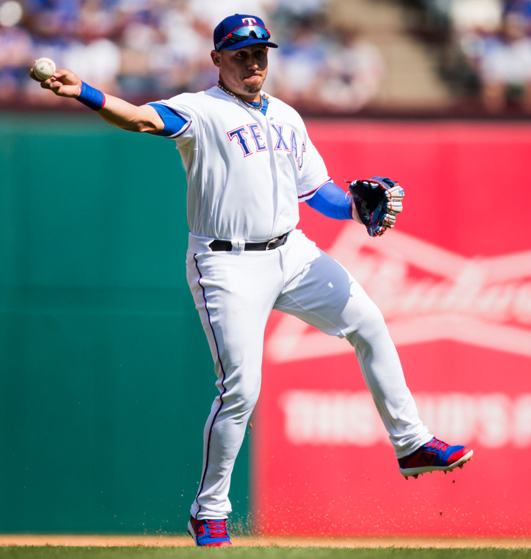 Texas Rangers third base Asdrubal Cabrera (14) throws to first during the first inning of an...