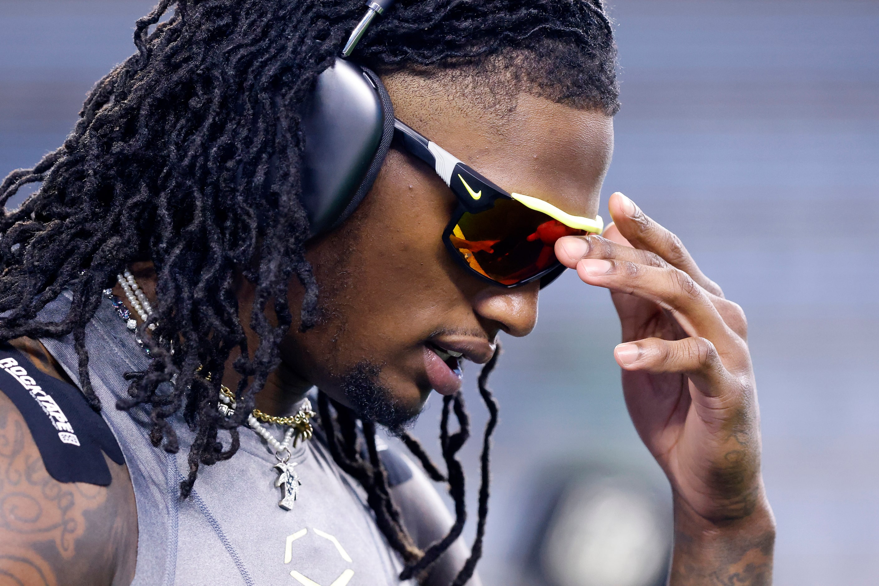 Dallas Cowboys wide receiver CeeDee Lamb focuses as he trains during warmups before facing...