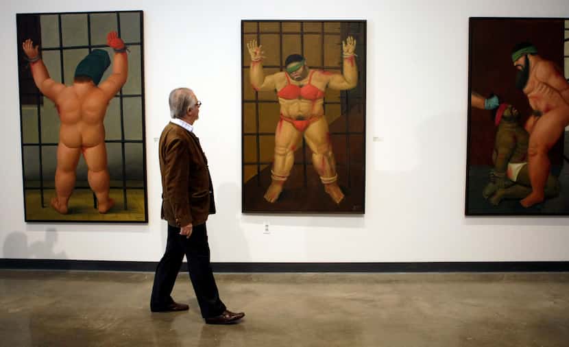 EDS NOTE: GRAPHIC CONTENT - FILE - Colombian artist Fernando Botero looks over his work at a...