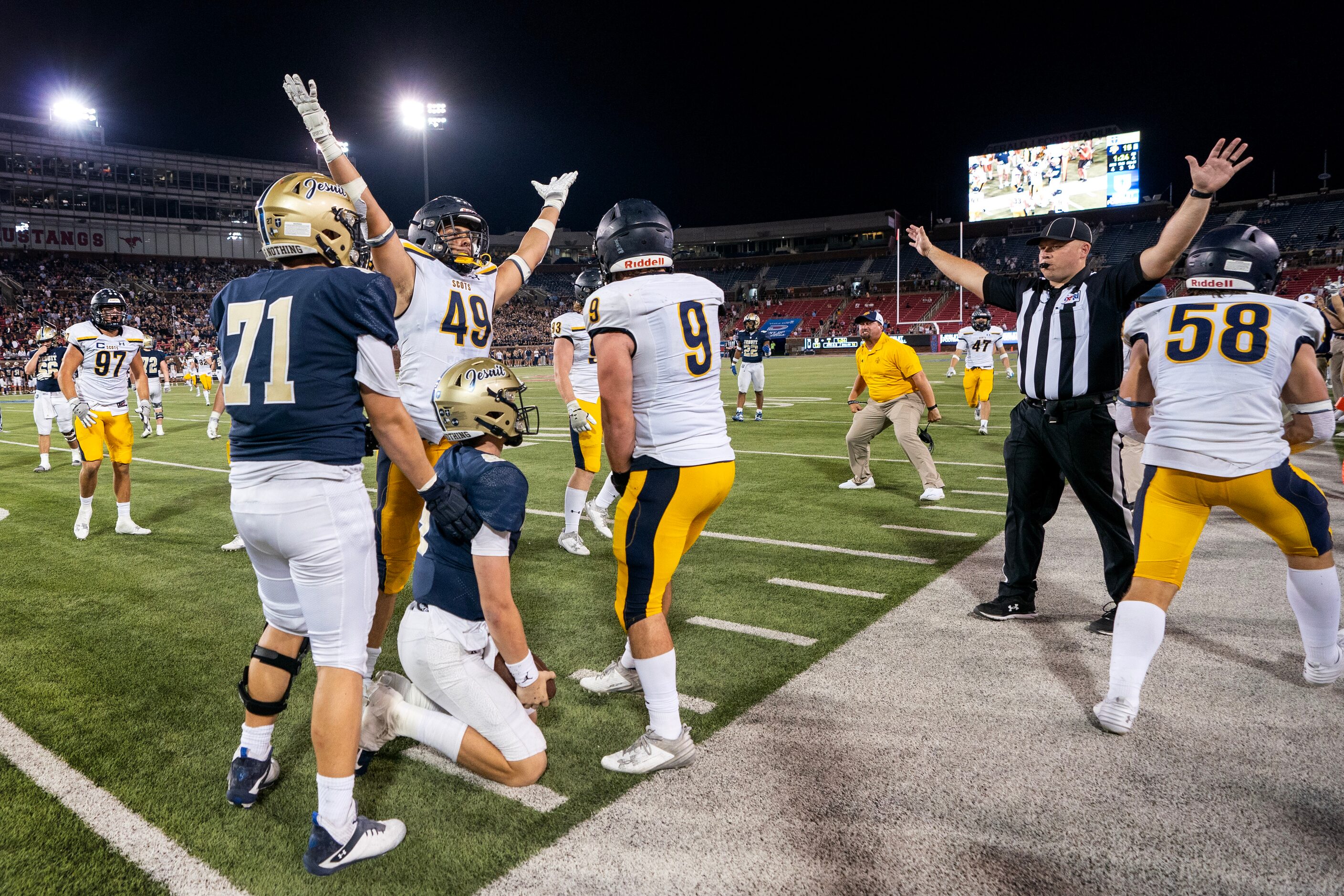 Highland Park junior linebacker Jack Morse (49) and senior linebacker Cormac Carroll (9)...