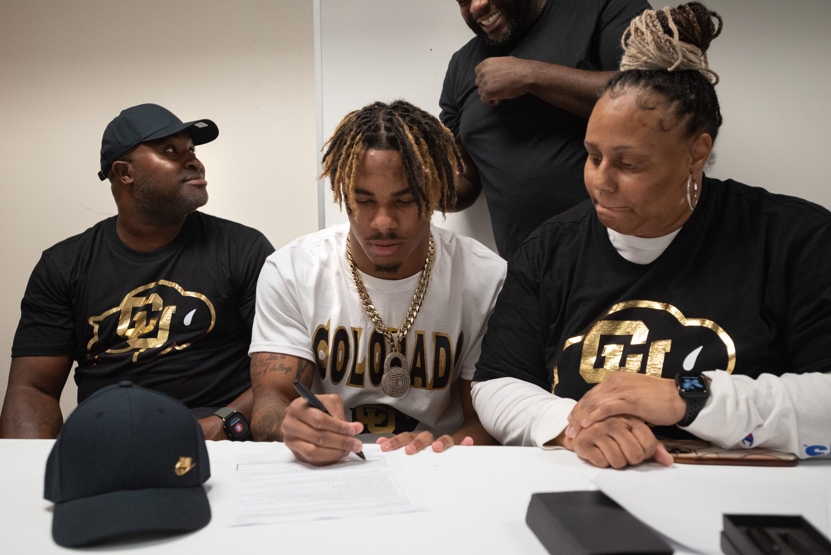 DeSoto high school football player Jaden Milliner-Jones signs his letter of intent to play...