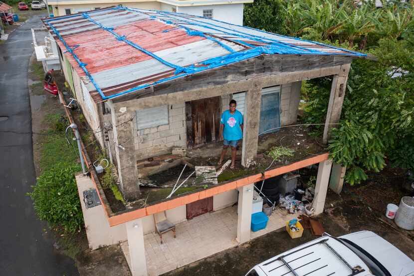 Jetsabel Osorio stands in her house damaged five years ago by Hurricane Maria before the...