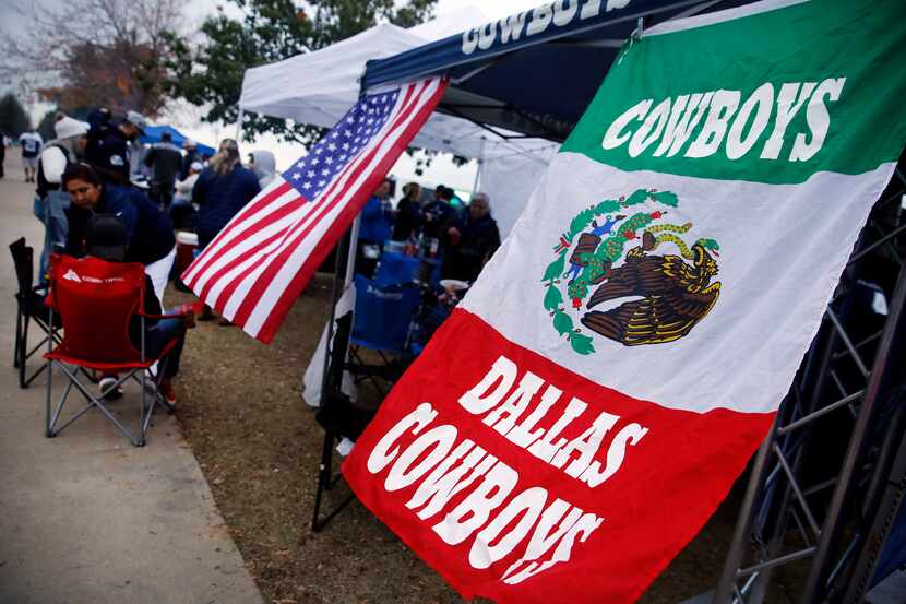 Dallas Cowboys fans from Mexico tailgate outside AT&T Stadium before a game against the...