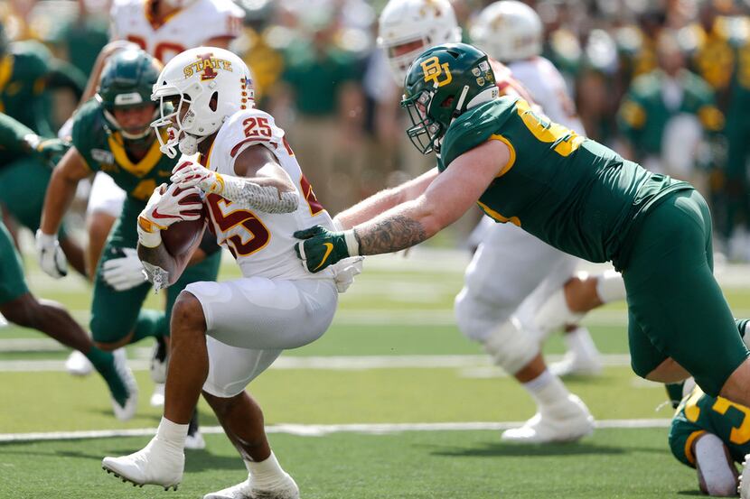 Baylor Bears defensive tackle James Lynch (93) tackles Iowa State Cyclones running back...