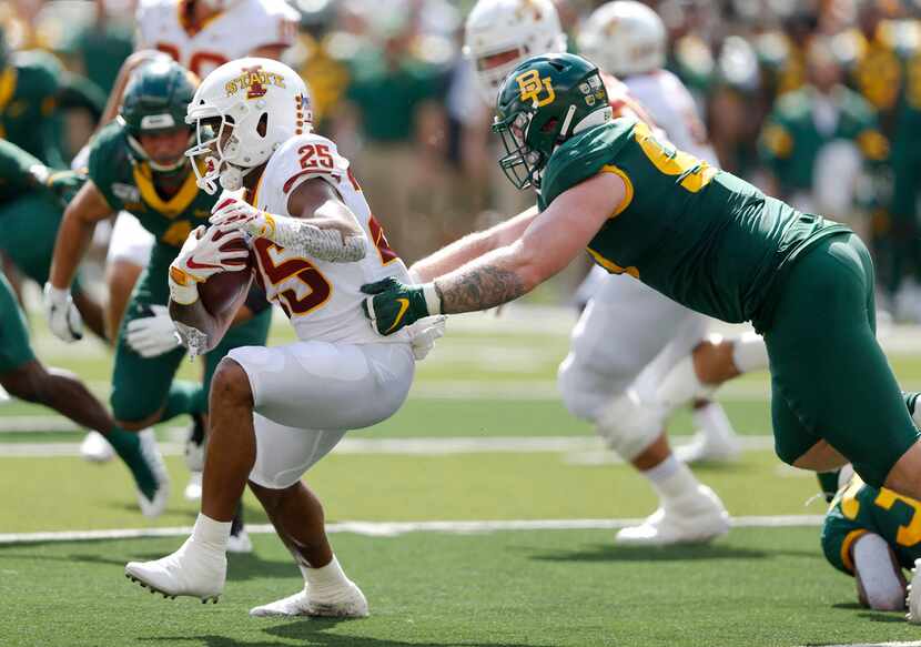 Baylor Bears defensive tackle James Lynch (93) tackles Iowa State Cyclones running back...