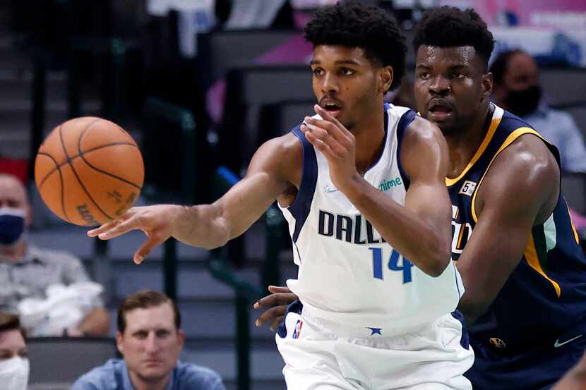 Dallas Mavericks rookie Feron Hunt (14) passes the ball against the Utah Jazz during the...