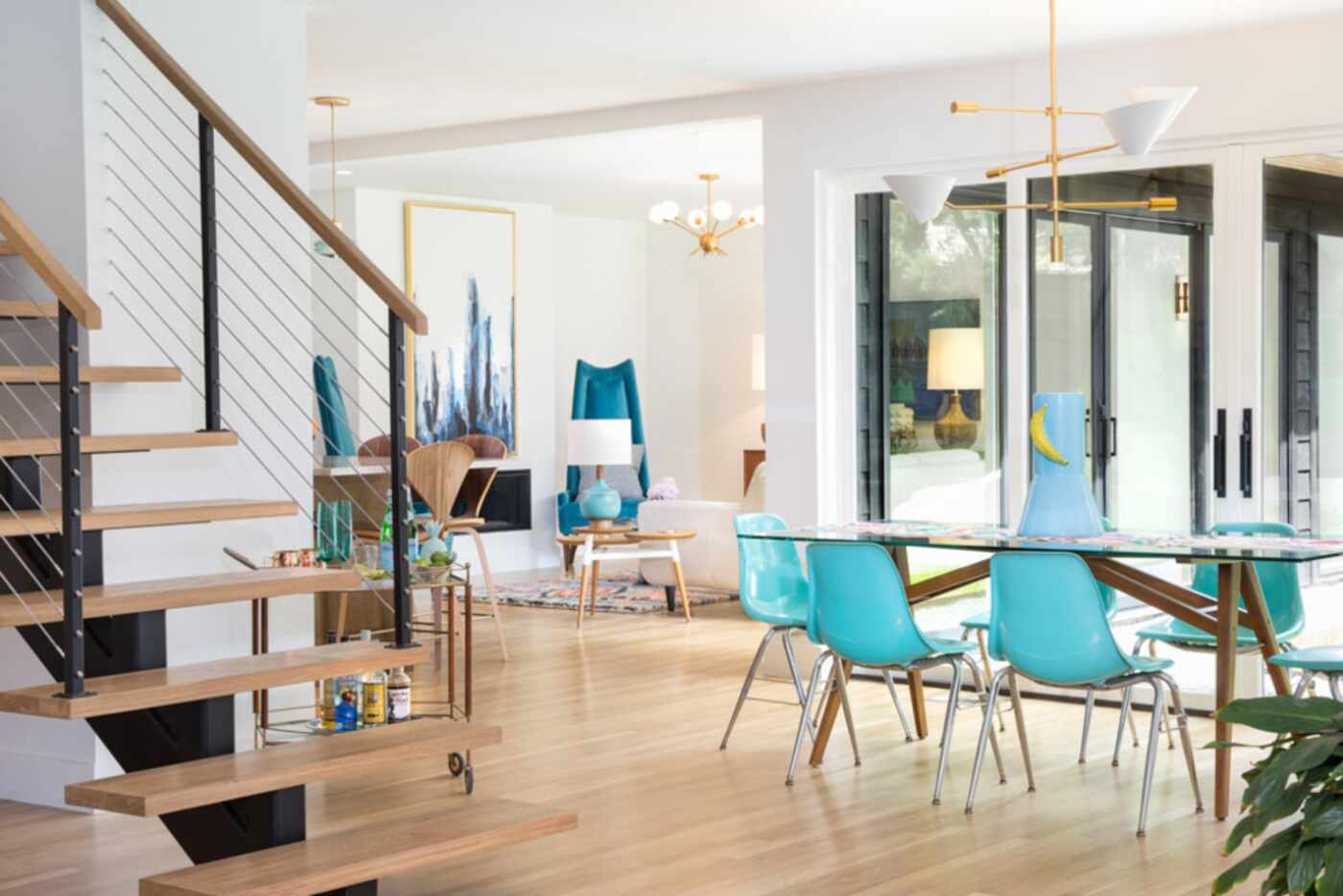 View of the dining room and floating staircase at a Casa Linda Avenue home, one of those on...