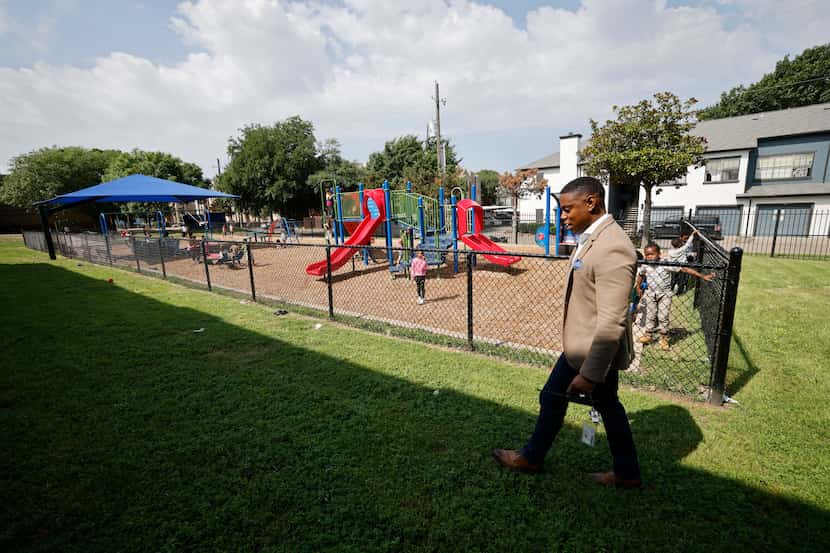 Forest Lane Academy Principal DeMarcus Goree-Watkins walks by a playground at the academy,...
