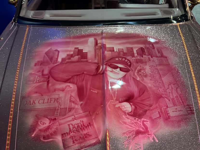 A closer look of the candy pink mural of Mercedes Mata on the hood of La Mera Mera.