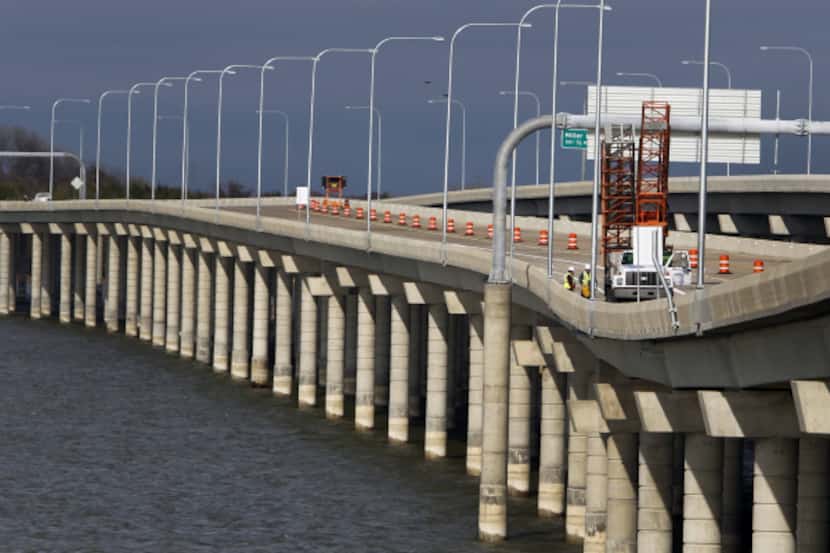 The Bush Turnpike's eastern extension, set to open Wednesday, crosses part of Lake Ray...