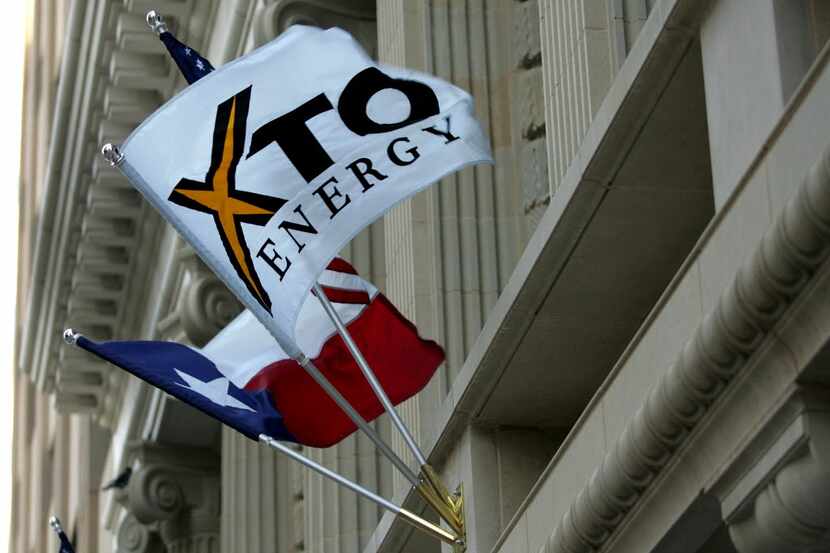 An XTO Energy flag adorns the new Bob R. Simpson Building, in Fort Worth Texas. (AP...