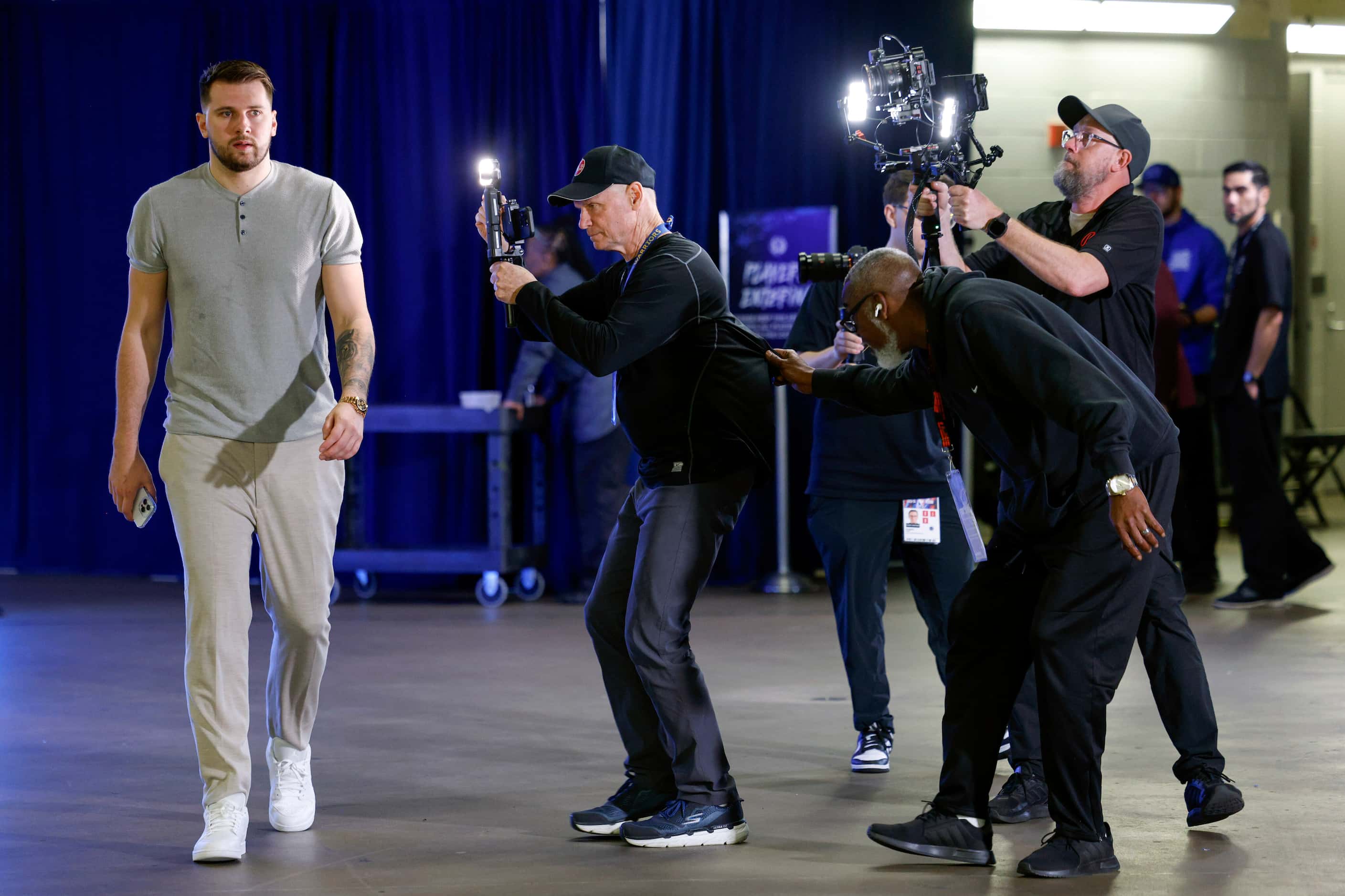 Dallas Mavericks guard Luka Doncic makes his way into the arena before Game 6 of an NBA...