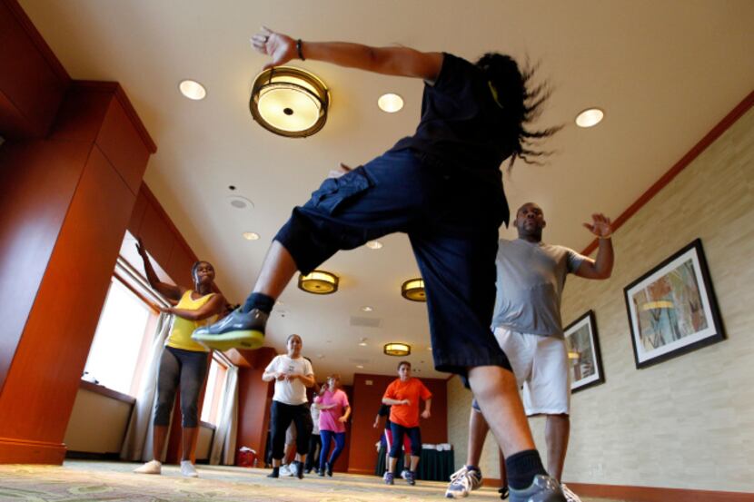 Ernesto Plazola leads a Zumba class for Sheraton Hotel employees in downtown Dallas.