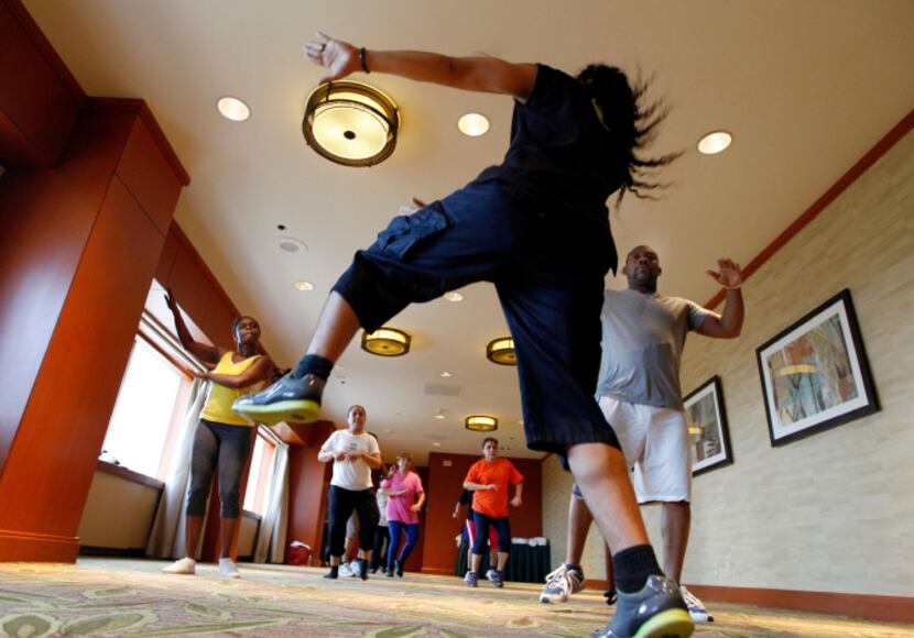 Ernesto Plazola leads a Zumba class for Sheraton Hotel employees in downtown Dallas.