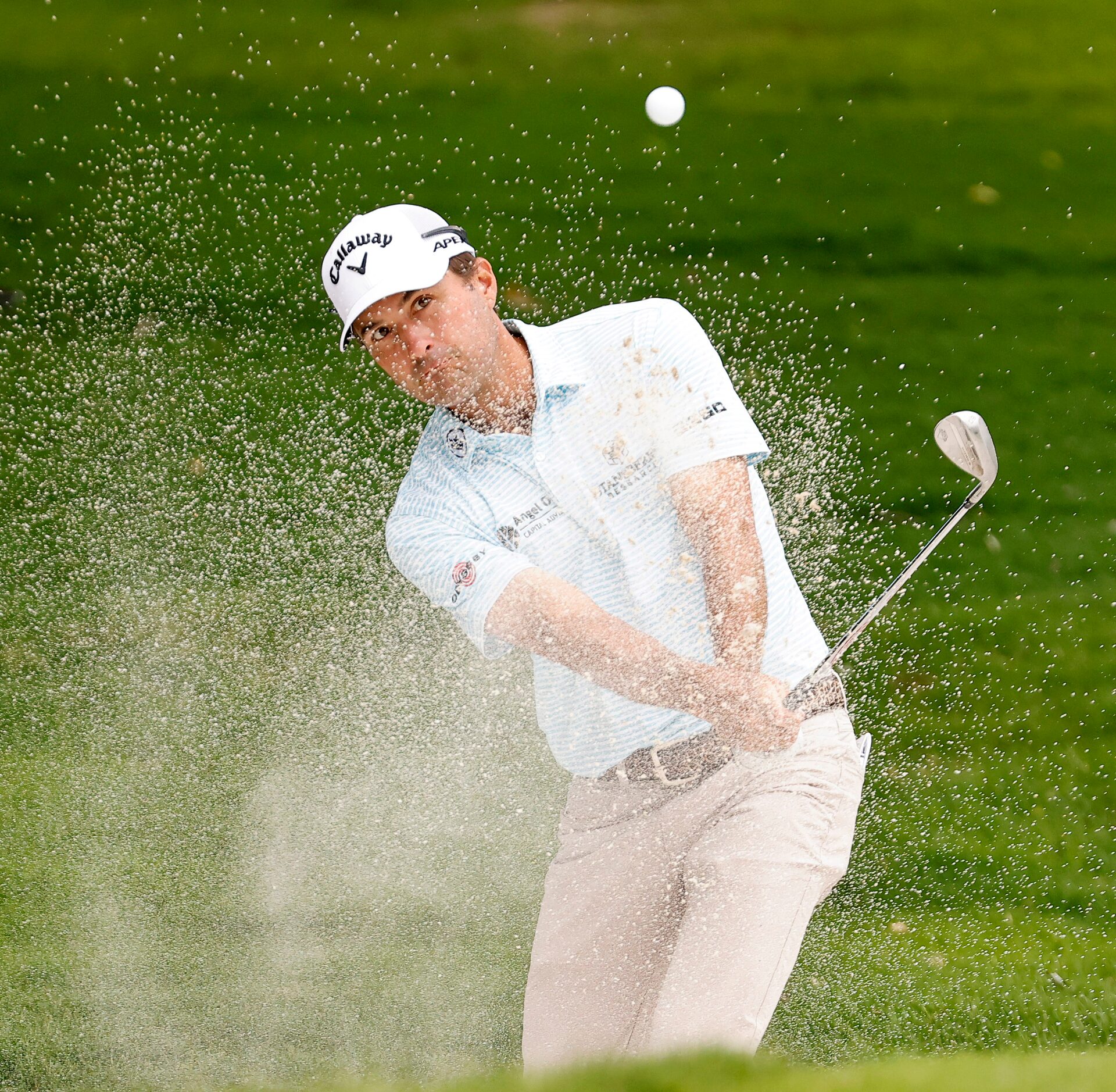 Professional golfer Kevin Kisner hits off the green side trapon on No. 5 during round two of...