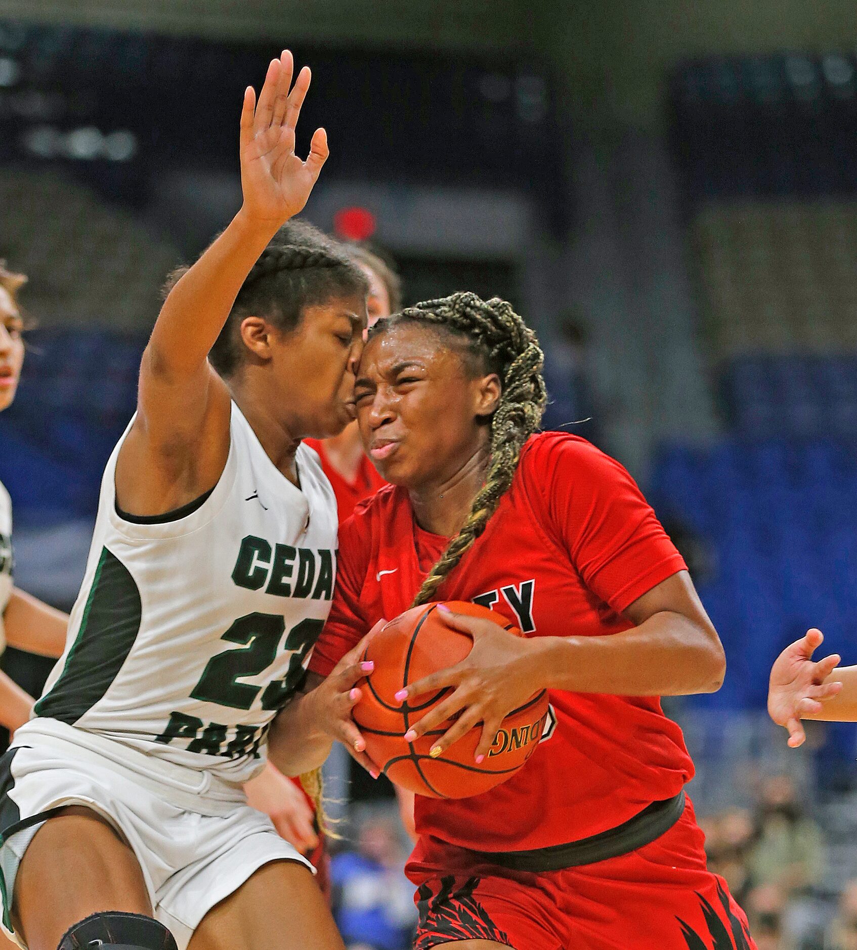 Frisco Liberty Jazzy Owens-Barnett #30 drives on Cedar Park Alisa Knight #23. Frisco Liberty...