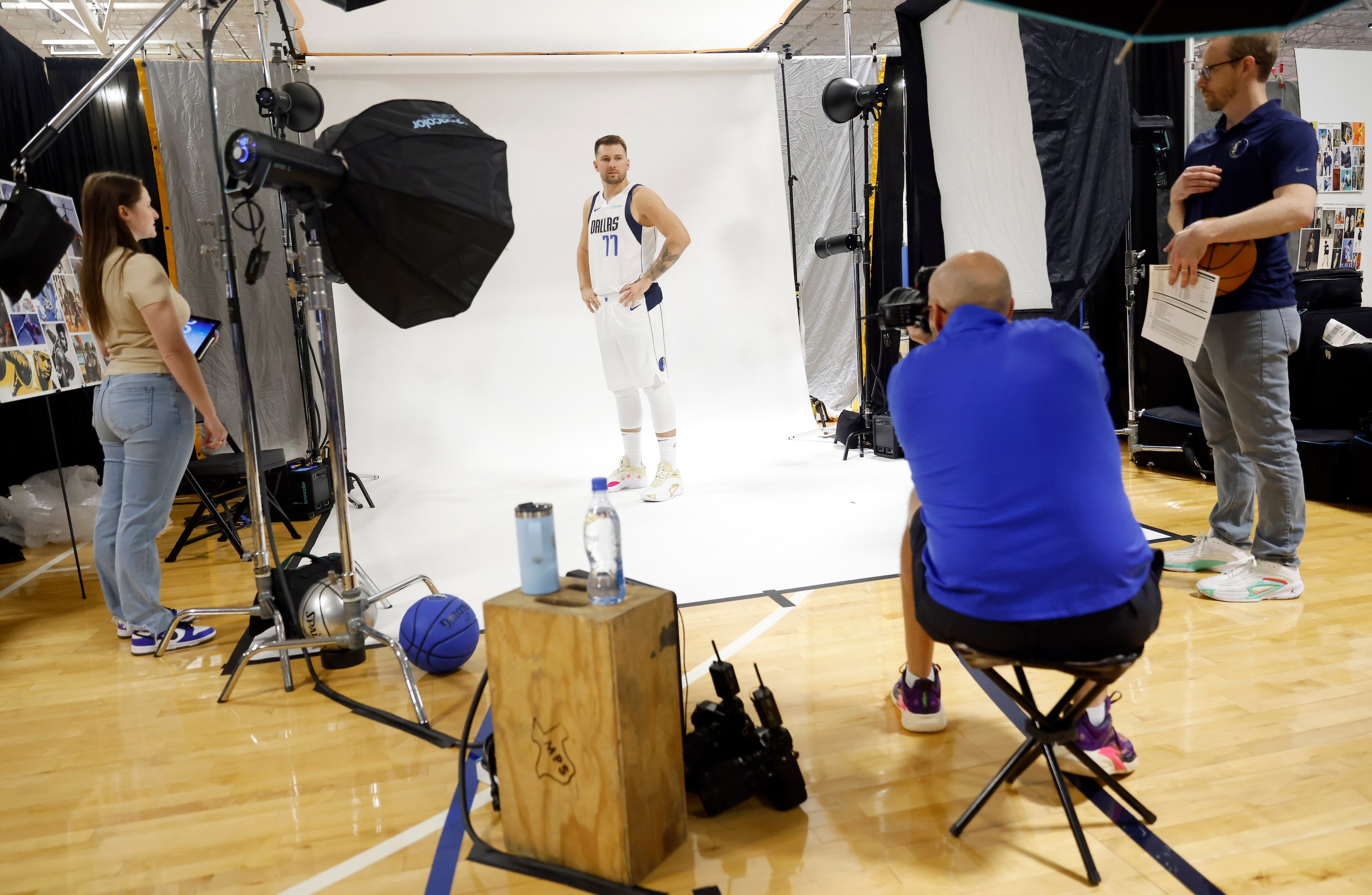 Dallas Mavericks guard Luka Doncic (77) poses on a large white backdrop for photographer...