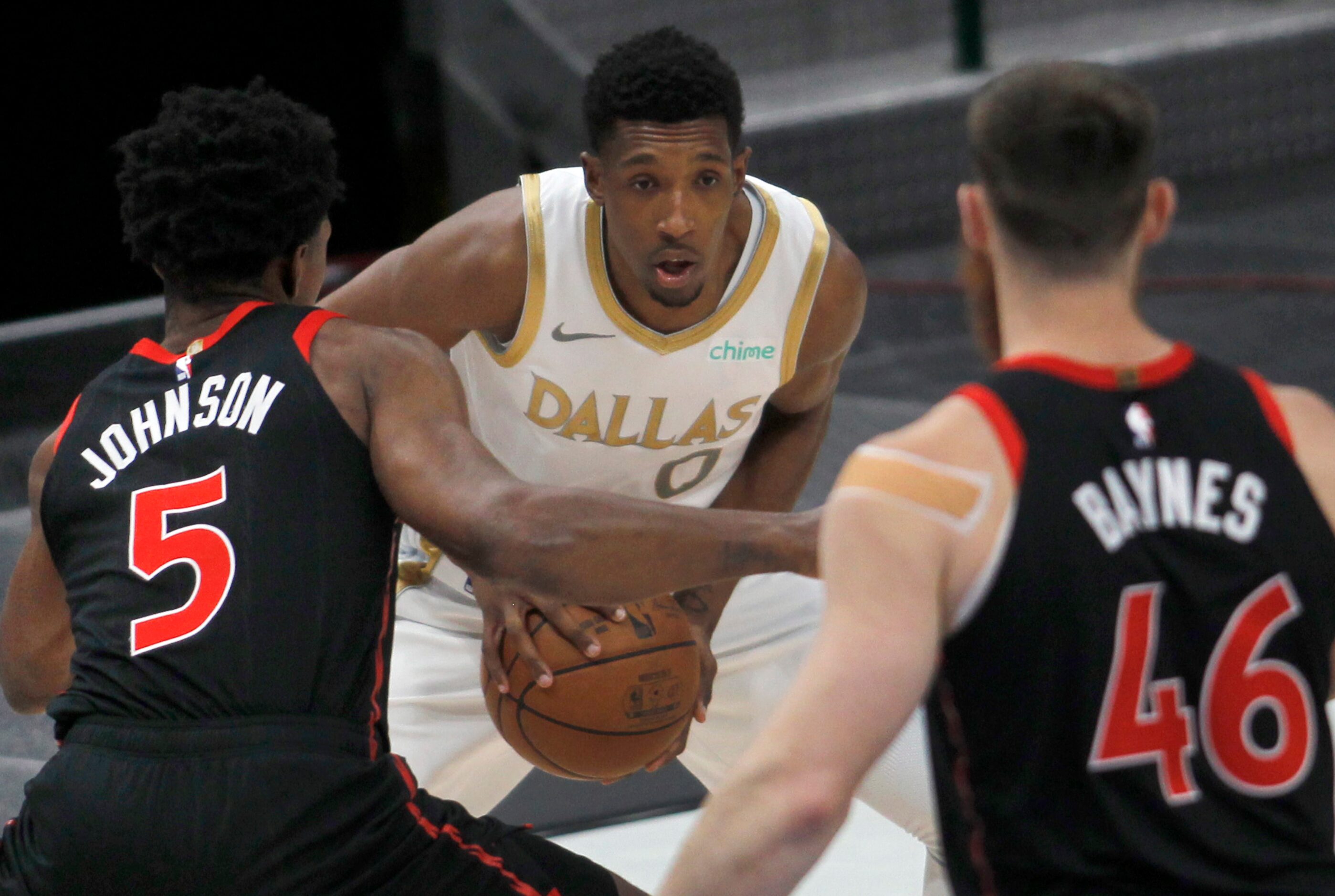 Dallas Mavericks guard Josh Richardson (0) finds himself surrounded by Toronto defenders...