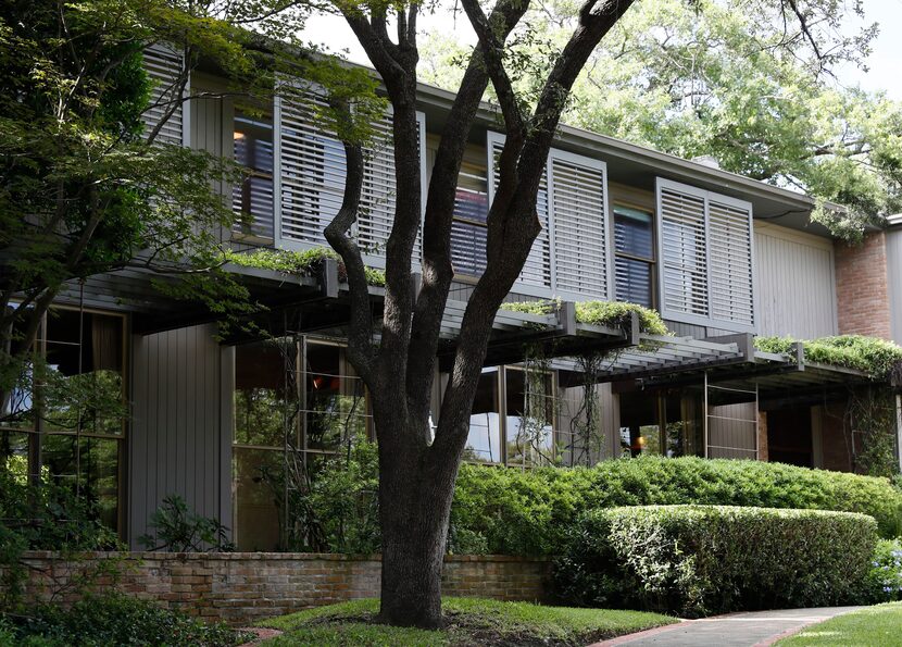 Architect O'Neil Ford added shutters suspended in air by metal roads to allow plenty of...