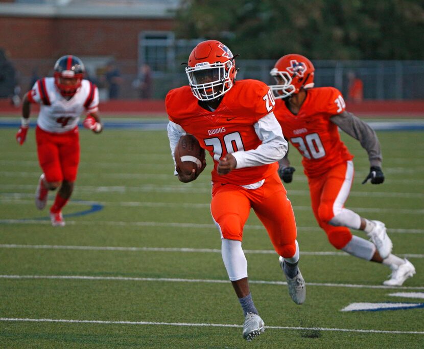 McKinney North's Devin Rivers (20) intercepts the ball for a touchdown against Centennial in...