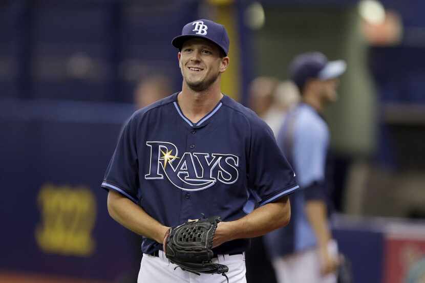 New Tampa Bay Rays starting pitcher Drew Smyly smiles after throwing a bullpen session...
