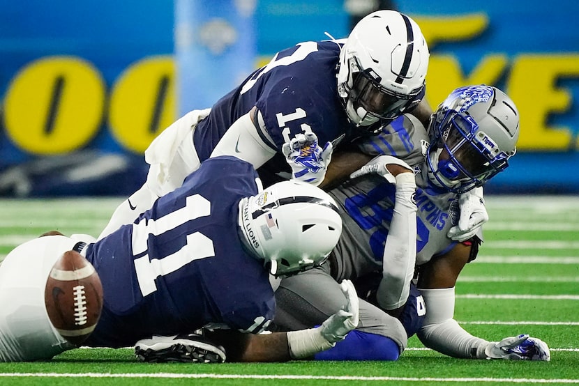 Memphis tight end Tyce Daniel (88) fumbles as he is hit by Penn State linebacker Micah...