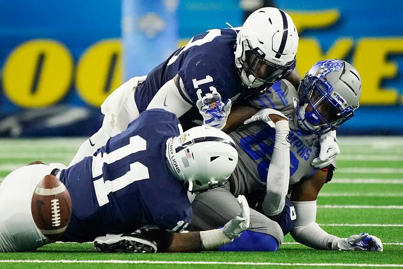 Memphis tight end Tyce Daniel (88) fumbles as he is hit by Penn State linebacker Micah...