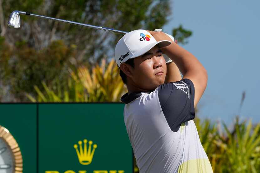 FILE - Tom Kim, of South Korea, watches his shot from the second tee during the second round...