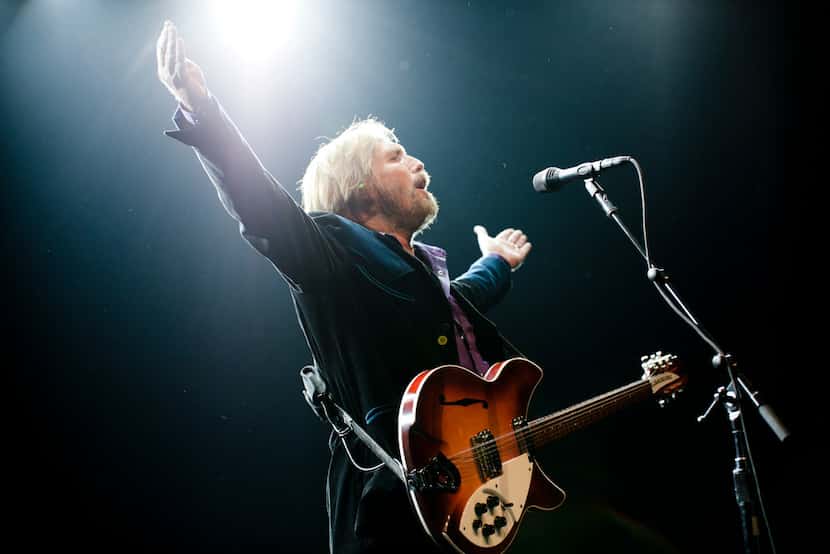 FILE - Tom Petty performs during the "Mojo Tour" at Madison Square Garden in New York, July...