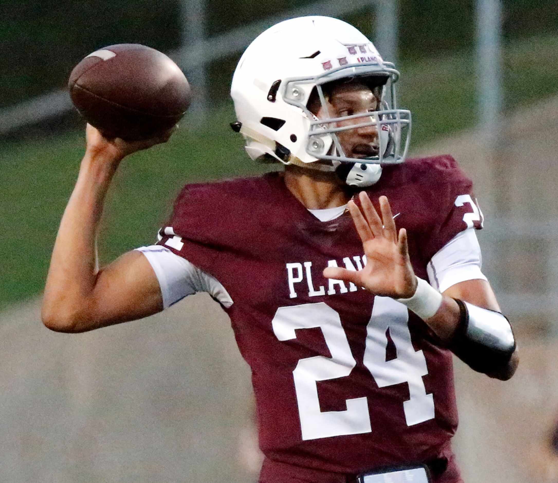 Plano High School quarterback Oliver Towns (24) throws a pass during the first half as Plano...
