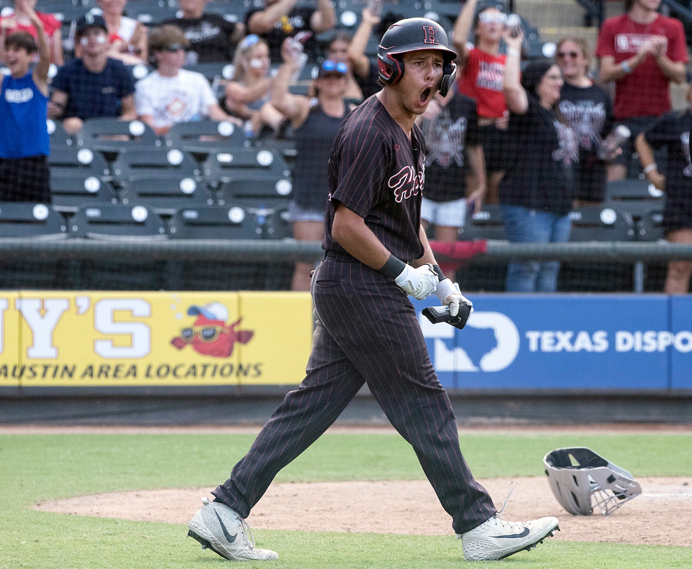 Rockwall-Heath Zach Rike, (21), celebrates the go ahead run against Keller during the sixth...